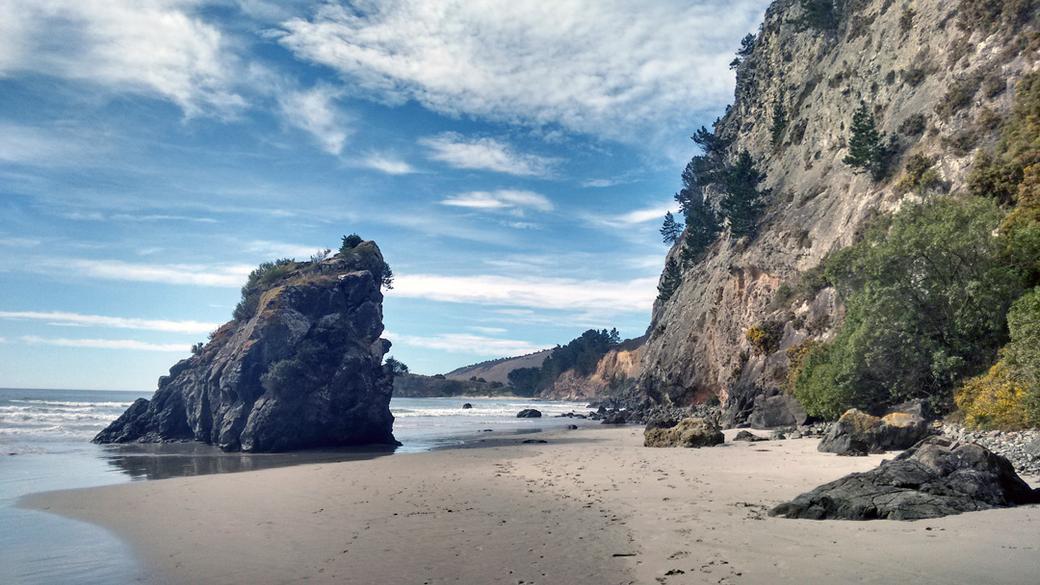 View of the beach past the cave