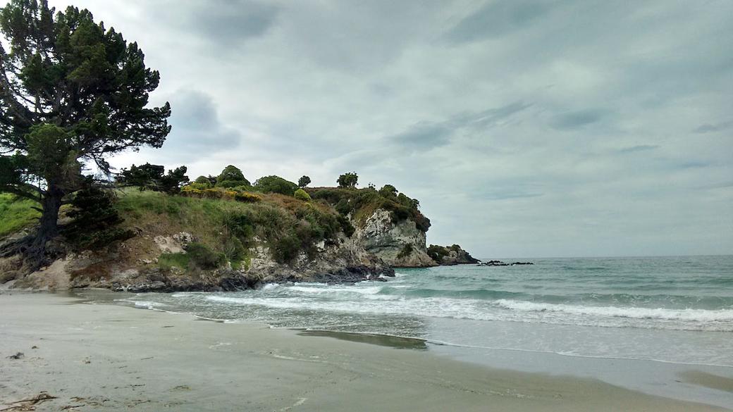 Looking at Mapoutahi Pa from the beach